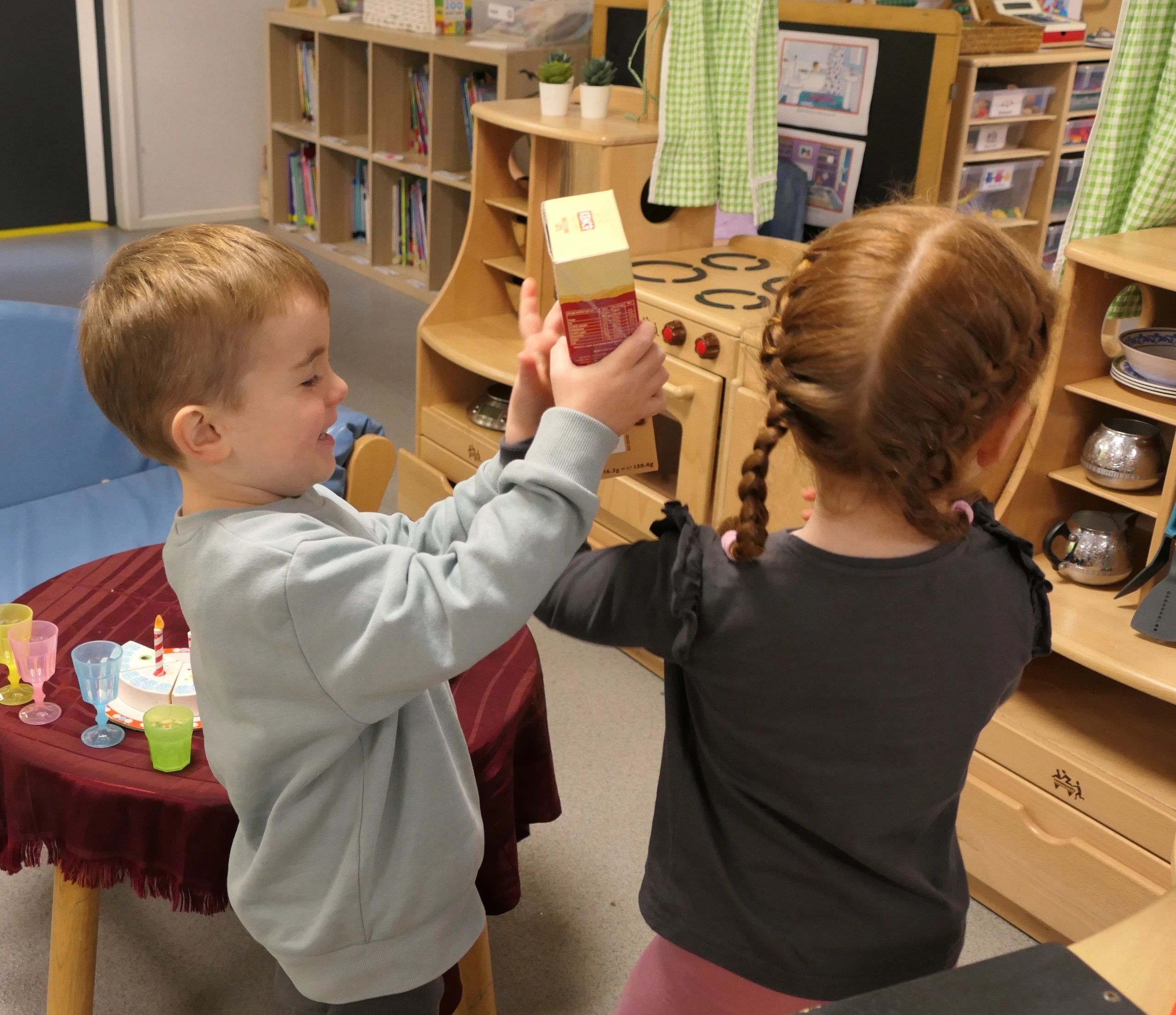Children engaged in learning activities at Little Chums